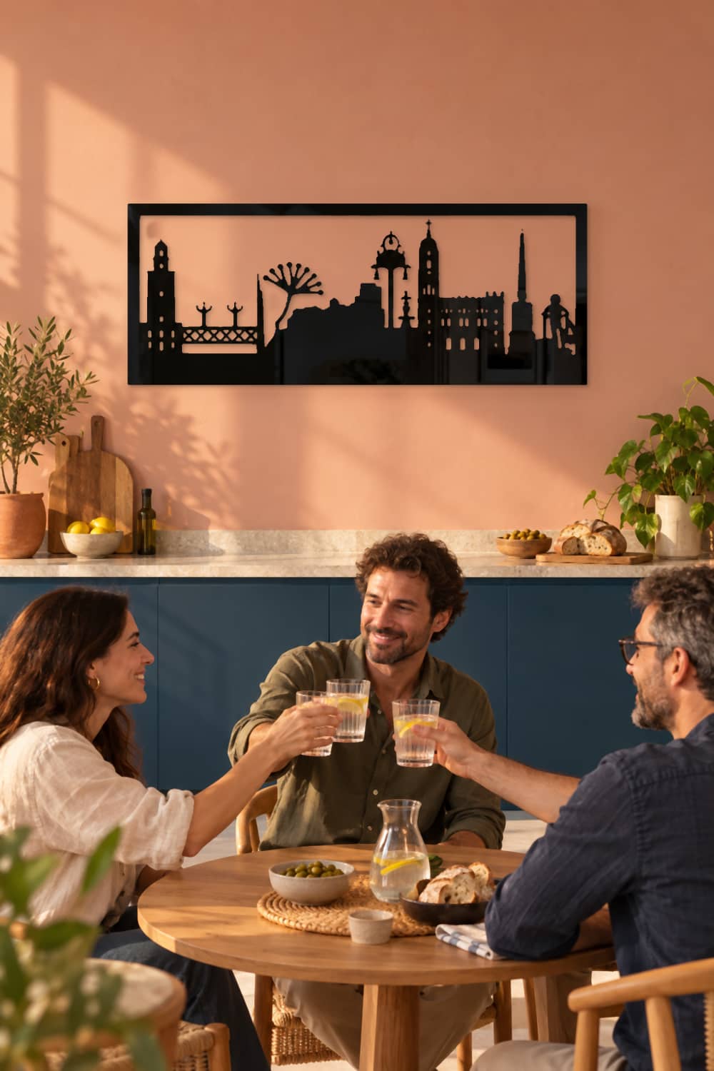 Cuadro Málaga en la cocina del coworking durante un brindis de equipo.